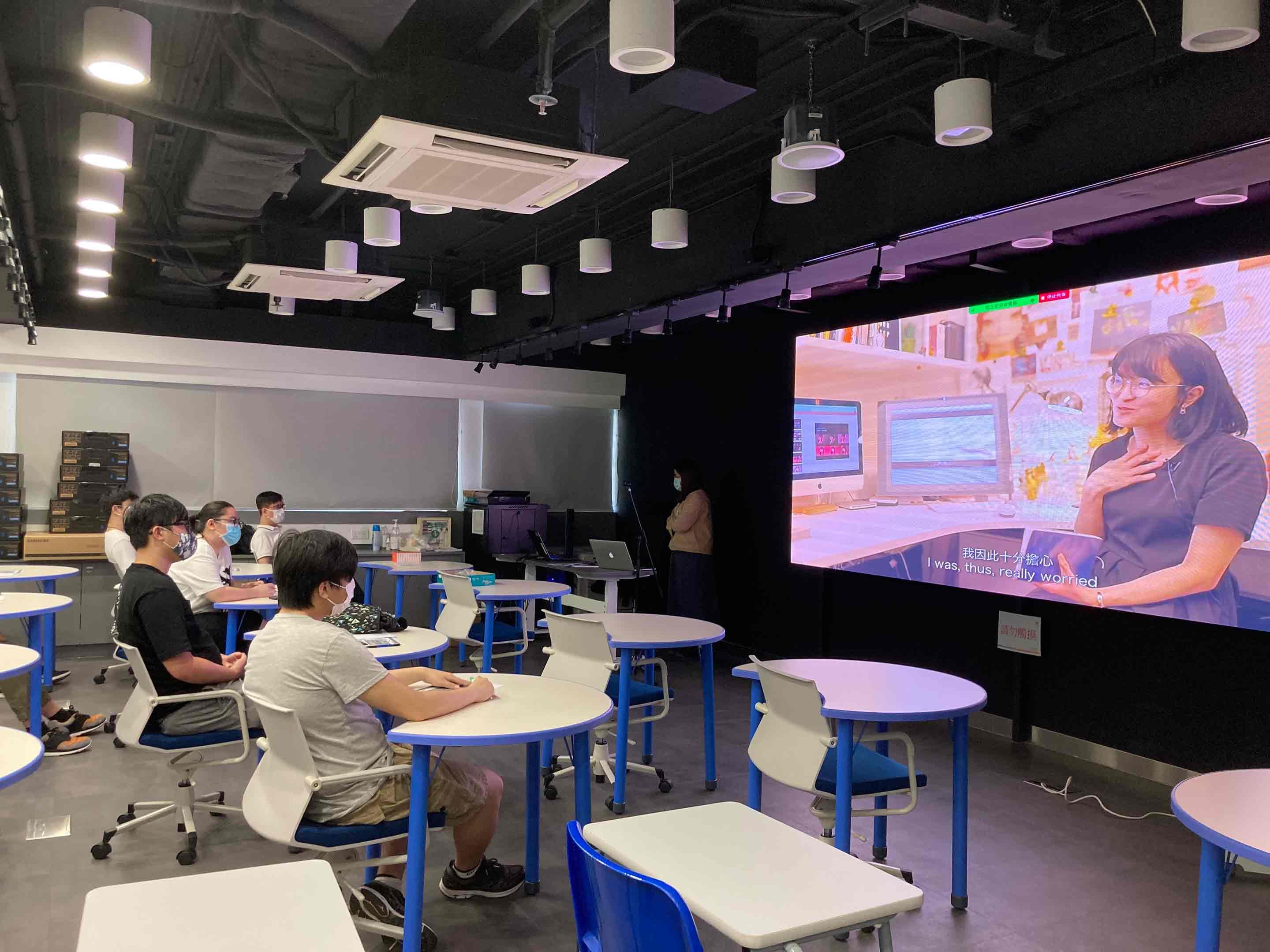 Students are enjoying to watch the short movie.